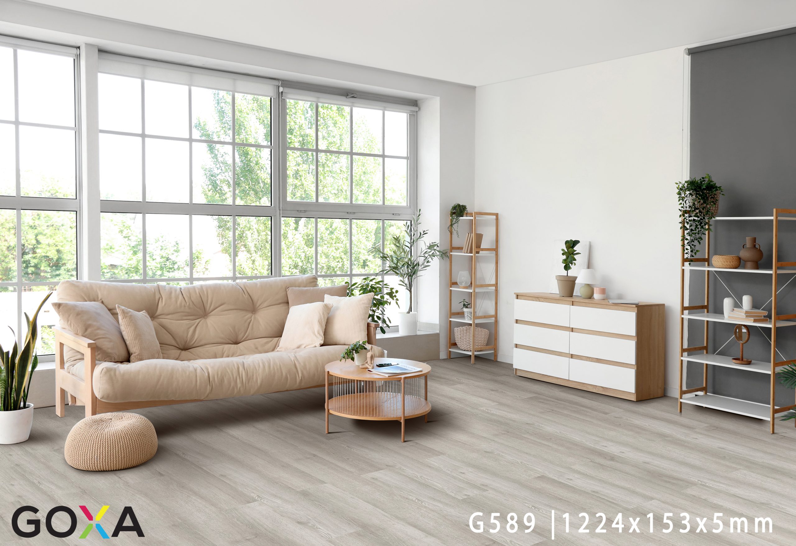 Interior of living room with soft couch, table and big window
